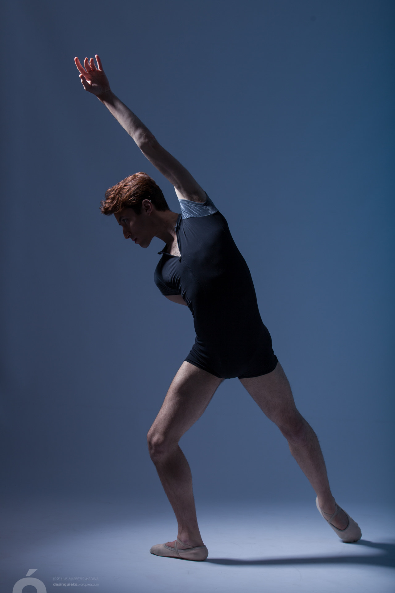 Young Redhead Woman Does Stretching And Yoga Poses Dancing Contemporary  Dance Posing In Studio Copy Space Stock Photo - Download Image Now - iStock